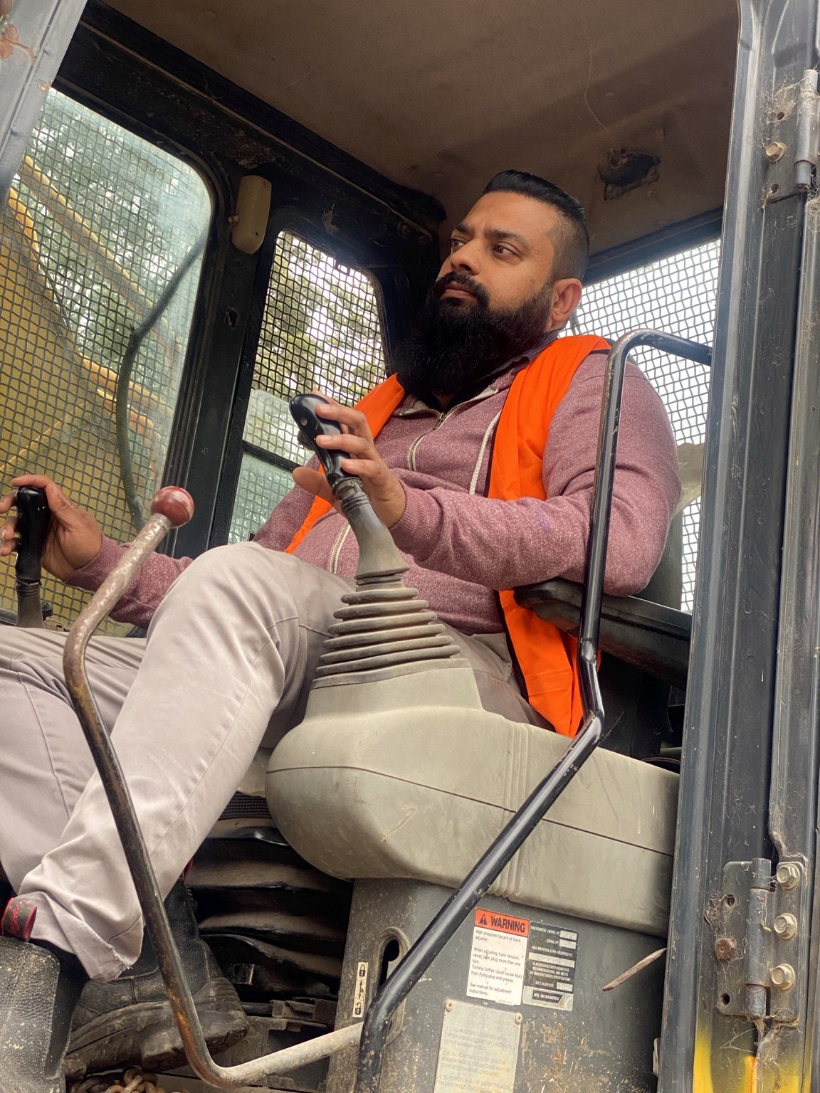 Trasher excavator operator at work